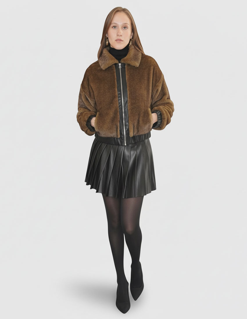 Chamarra teddy con vinipiel en color negro