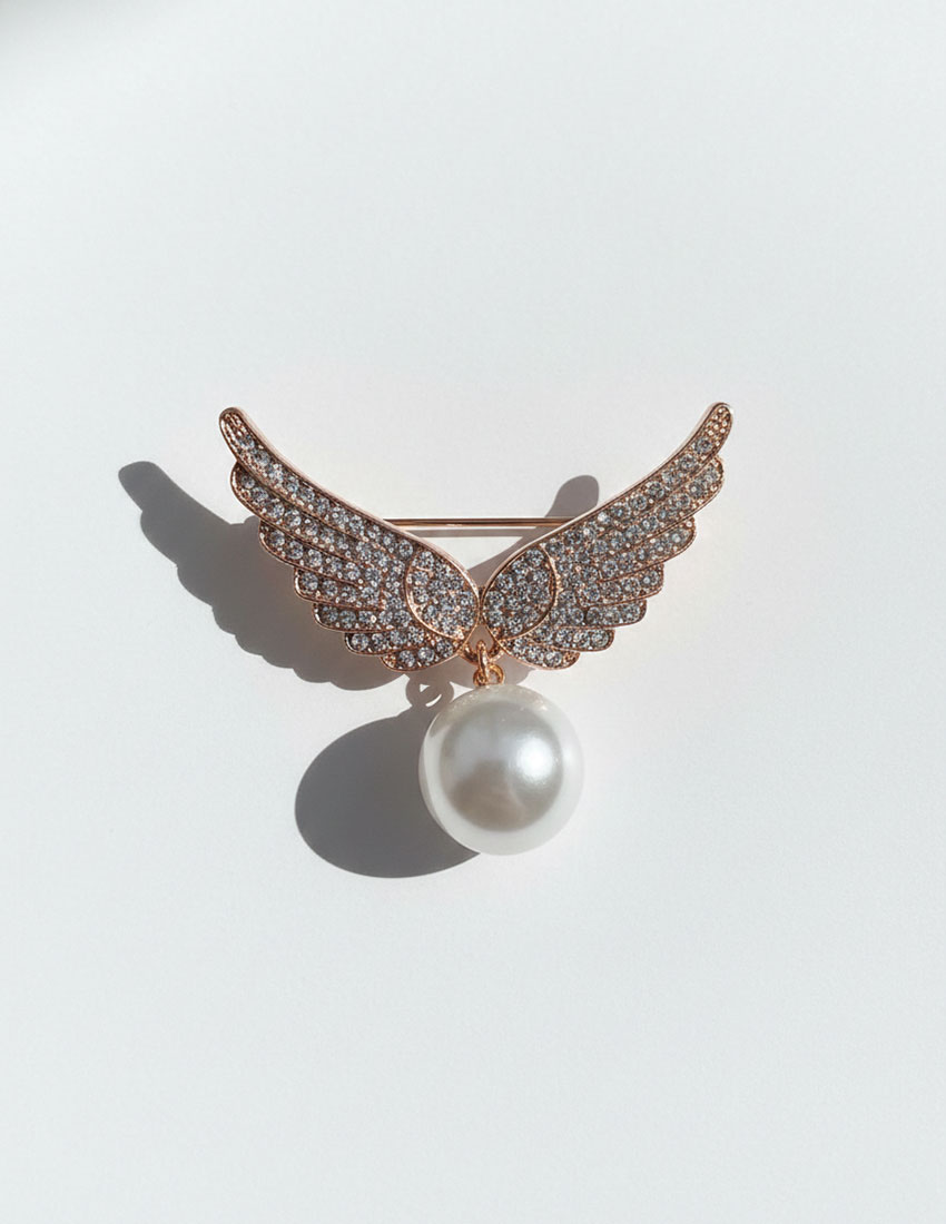 Broche diseño alas con perla de imitación